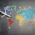 Top view of crop anonymous person holding toy airplane on colorful world map drawn on chalkboard