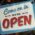 Vintage-style open sign welcoming customers into a Nashville shop. Perfect for illustrating business atmosphere.